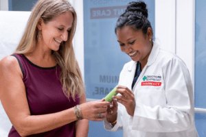 doctor showing medical cannabis product to patient